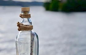 Message in a bottle cruising Loch Urquart on Loch Ness